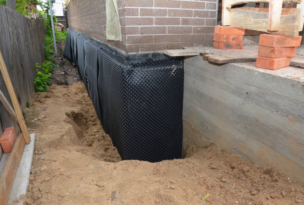 Happy homeowners after waterproofing job in Muncie